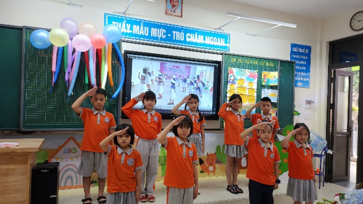 A picture containing text, person, indoor, group

Description automatically generated