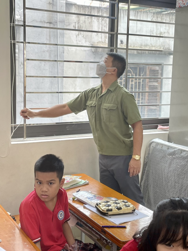 A picture containing text, person, indoor, young
Description automatically generated