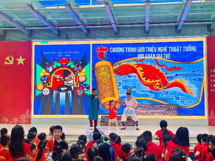 A group of people on stageDescription automatically generated with low confidence