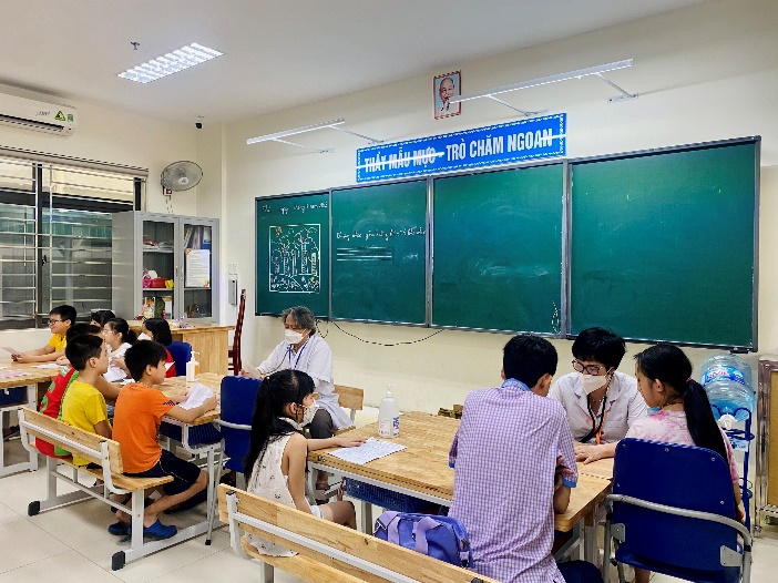 A picture containing text, person, indoor, ceiling

Description automatically generated