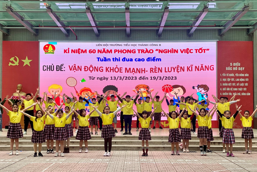 A picture containing text, group, posing
Description automatically generated