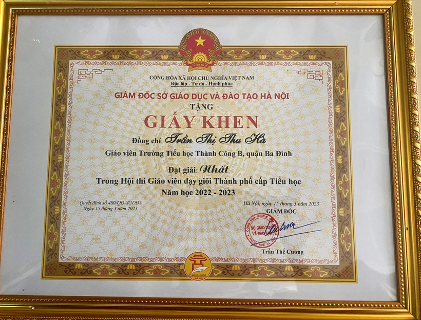 A picture containing text, picture frame, rug
Description automatically generated