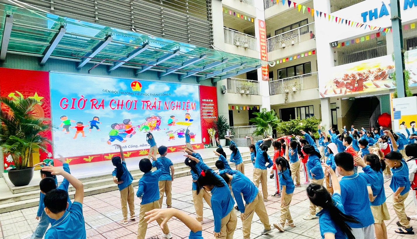 A group of children in blue shirts
Description automatically generated