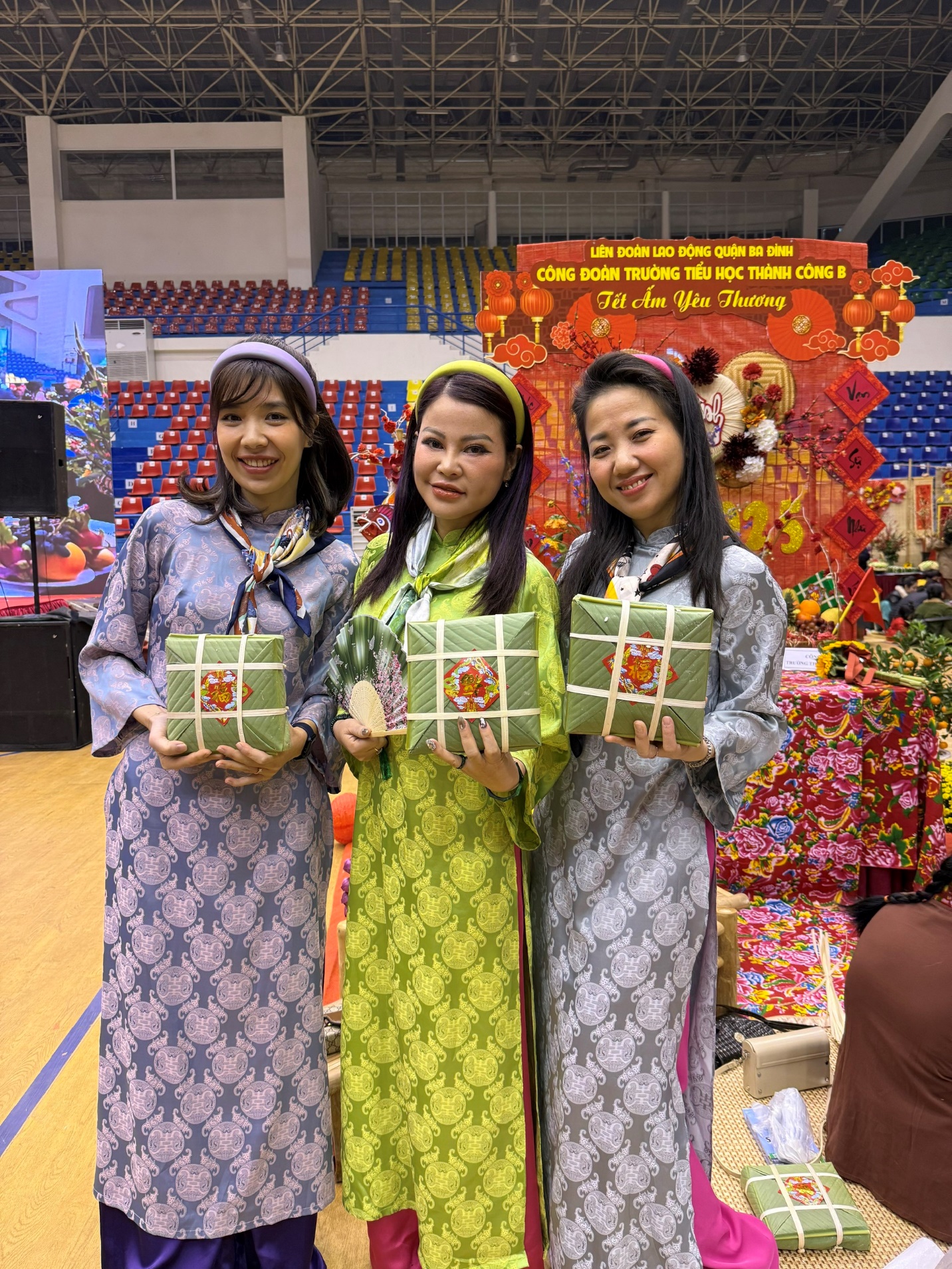 A group of women holding presents
Description automatically generated