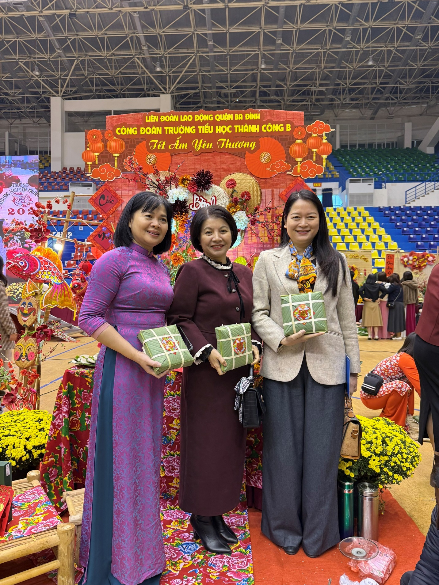 A group of women holding gift boxes
Description automatically generated