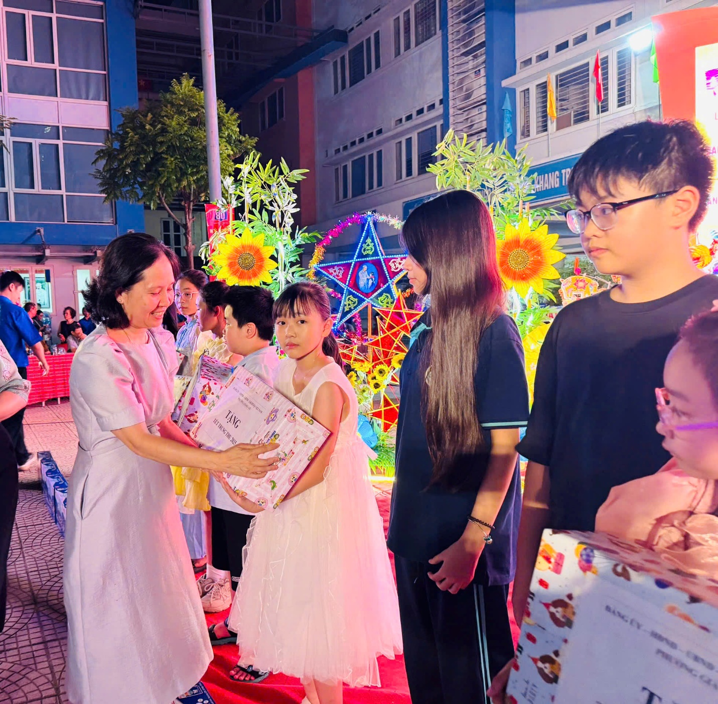 A group of people standing outside
Description automatically generated