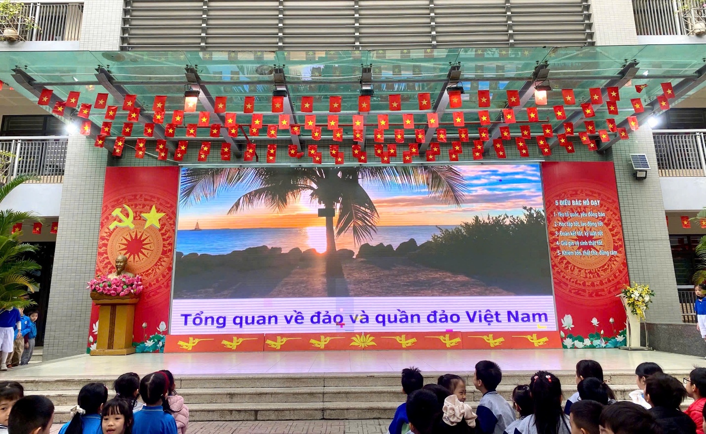 A group of people sitting on stairs in front of a stage
AI-generated content may be incorrect.