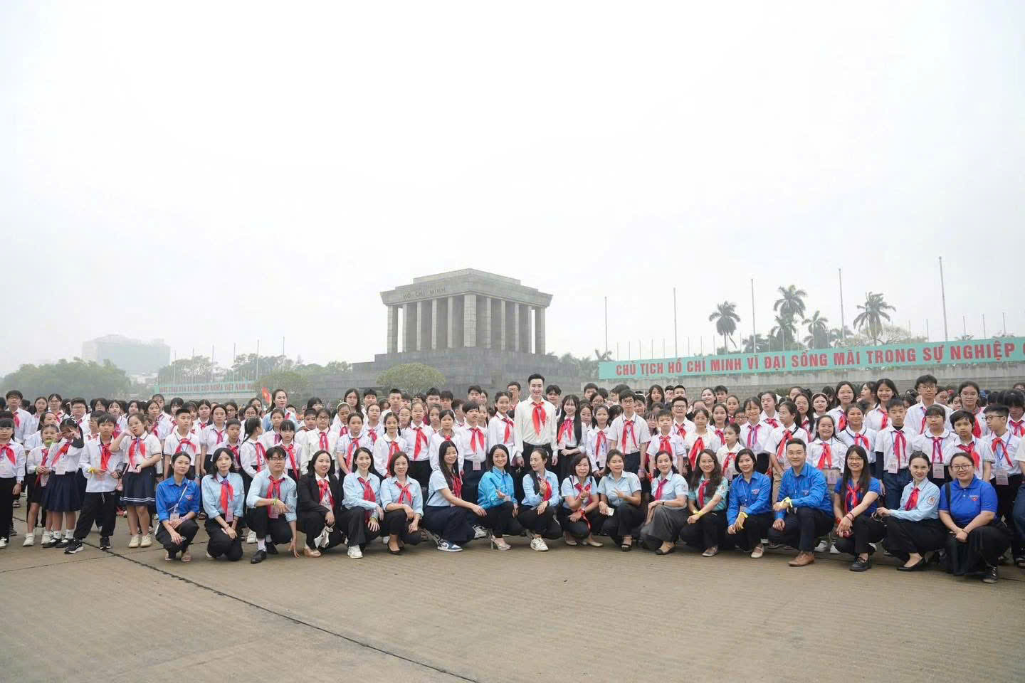 A group of people posing for a photo

Description automatically generated