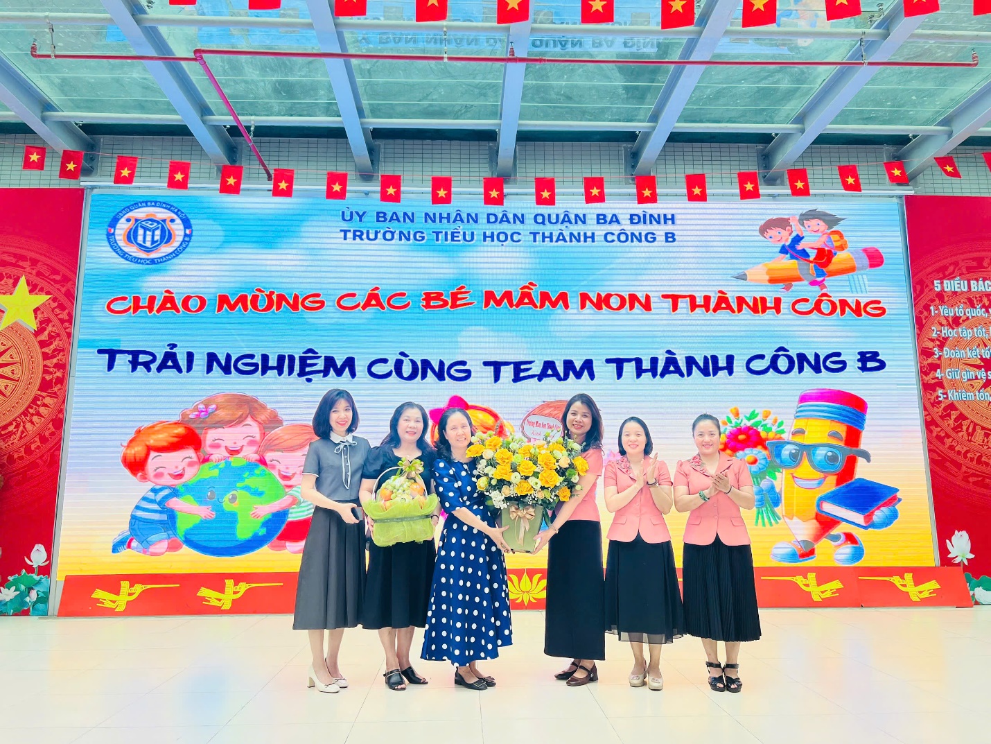 A group of women standing in front of a banner

AI-generated content may be incorrect.