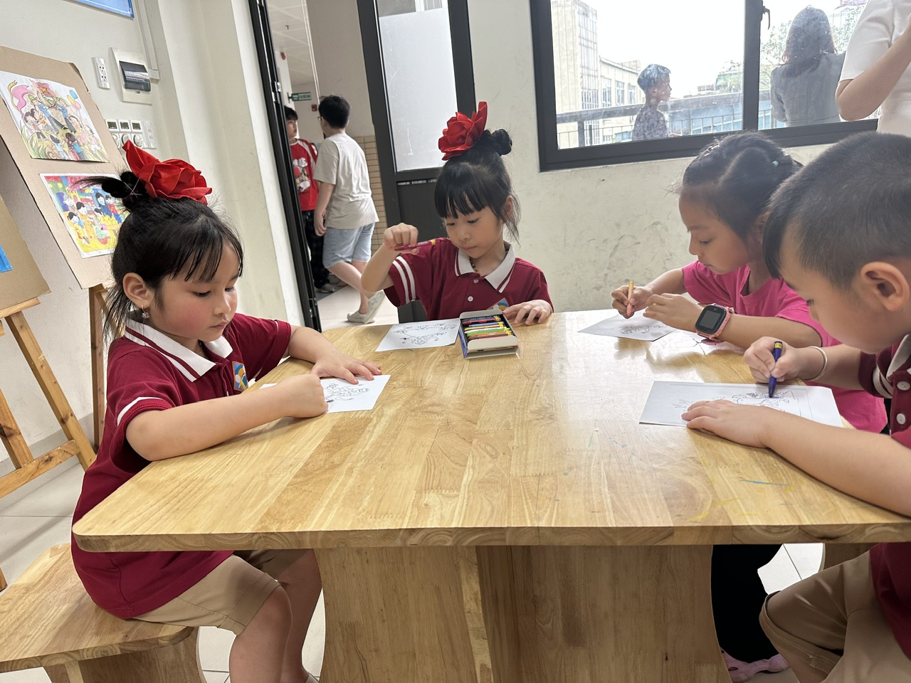 A group of children sitting at a table

AI-generated content may be incorrect.