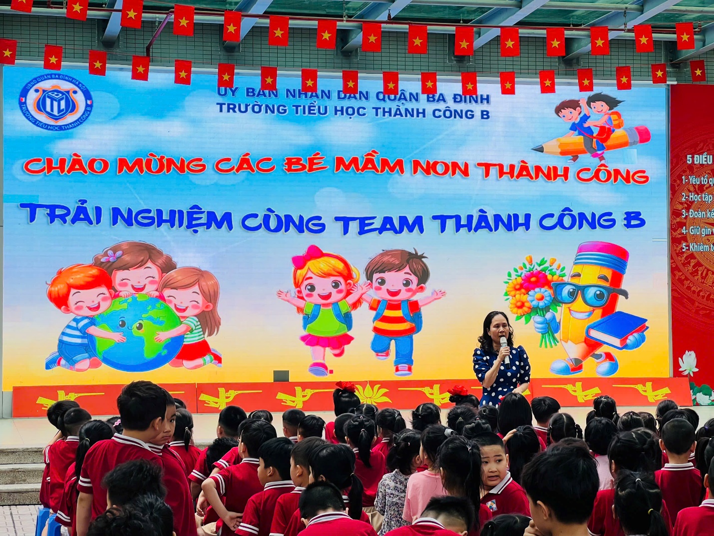 A group of people in front of a large banner

AI-generated content may be incorrect.