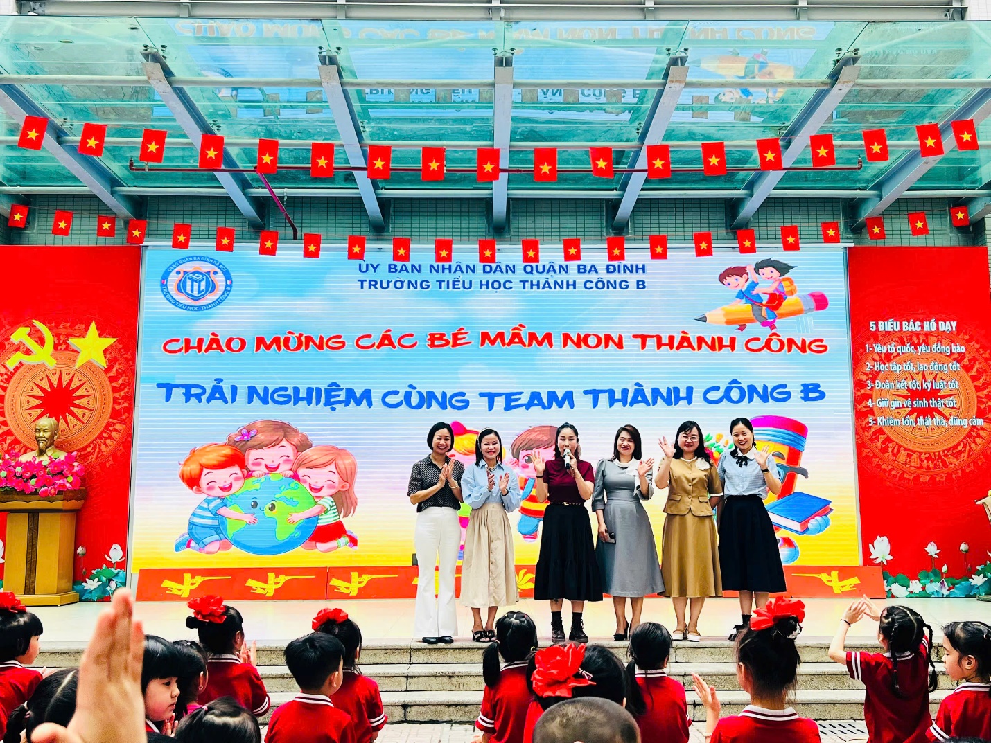 A group of people singing on a stage

AI-generated content may be incorrect.