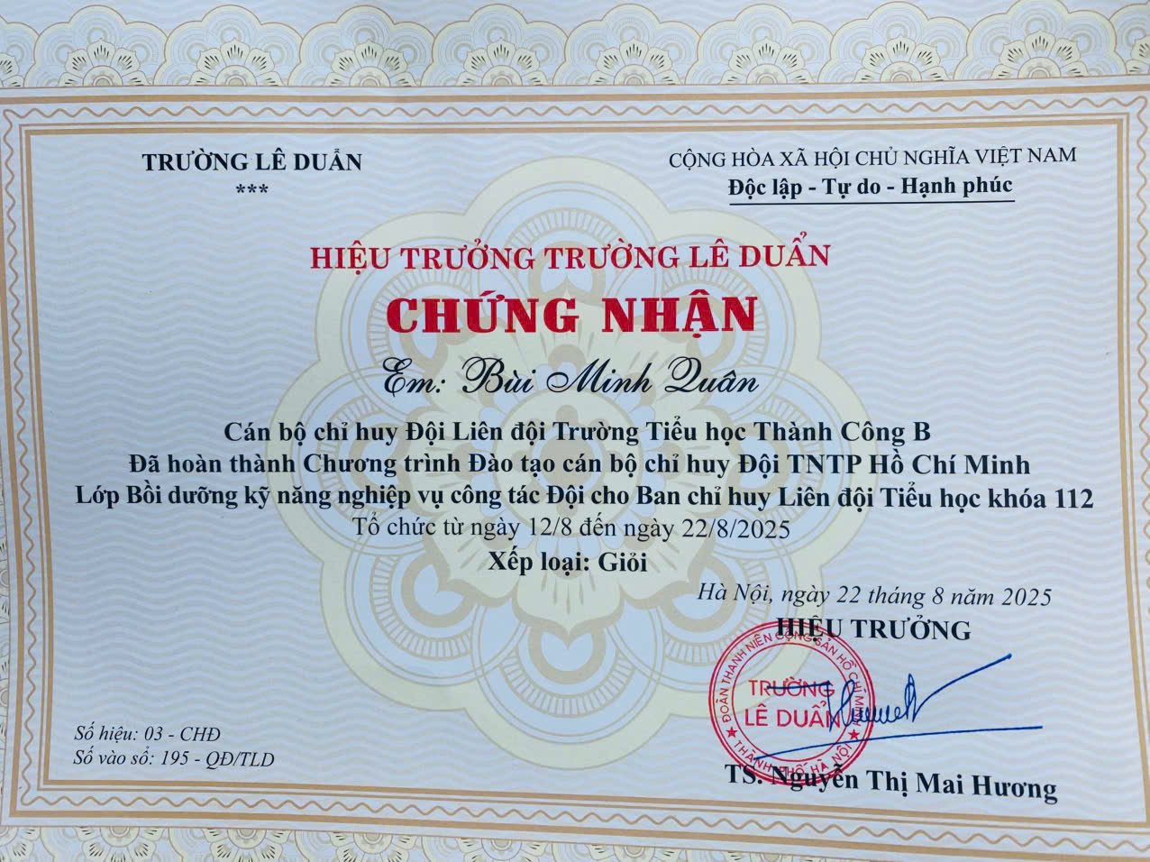 A certificate with red text and blue text
Description automatically generated