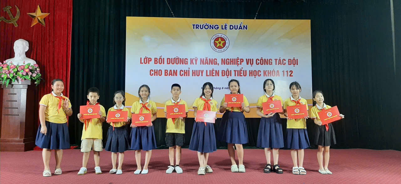 A group of young girls holding certificates
Description automatically generated