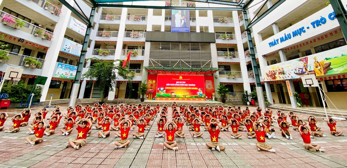 A group of people in red shirts
Description automatically generated