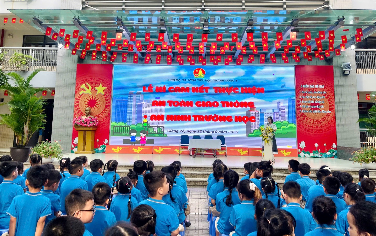 A group of people in blue shirts
Description automatically generated