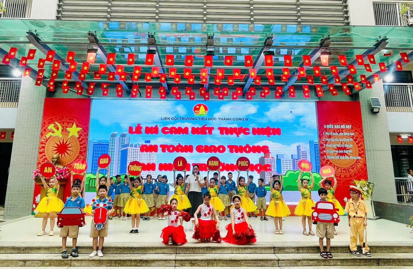 A group of children performing on stage
Description automatically generated