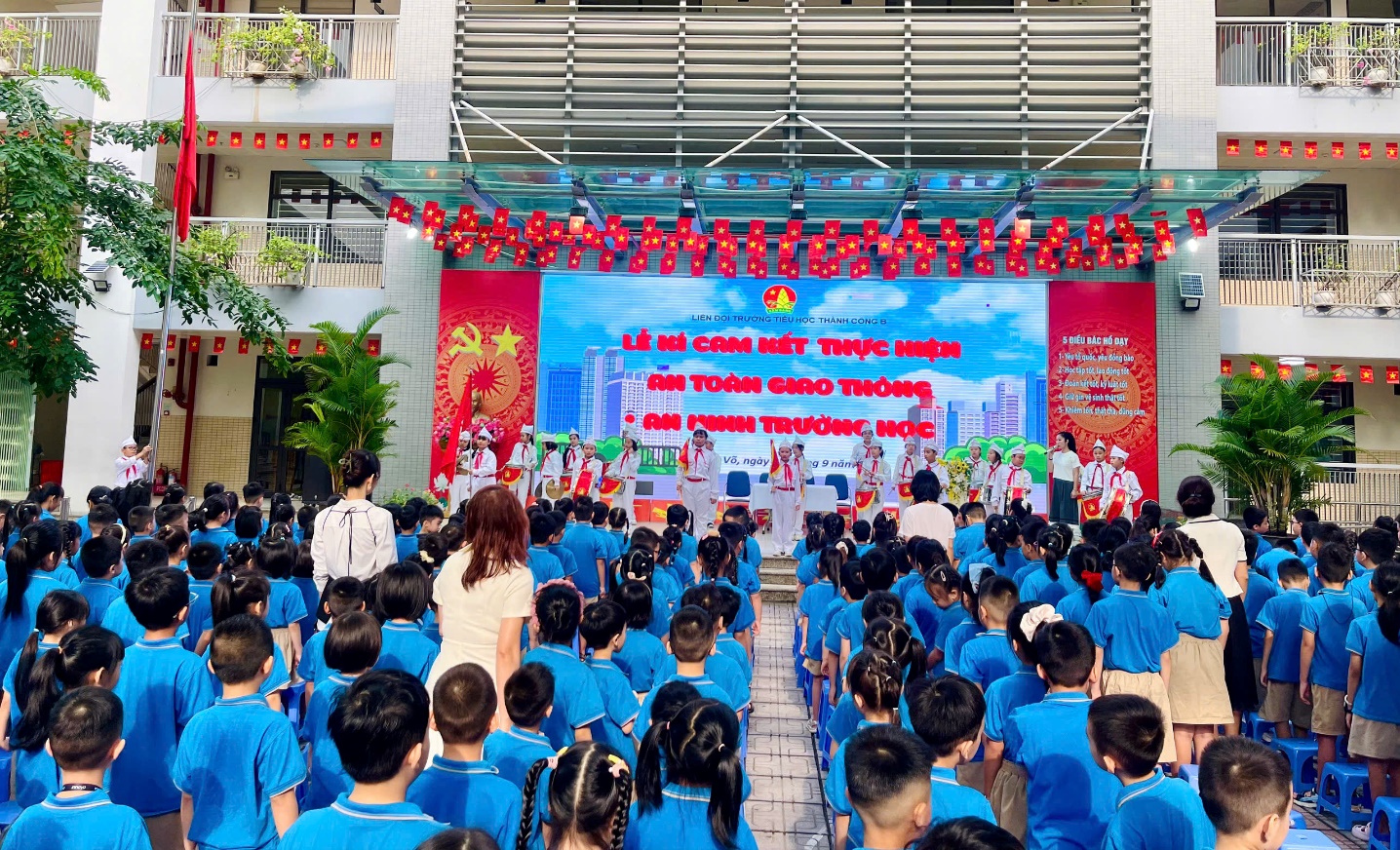 A group of people in blue shirts
Description automatically generated