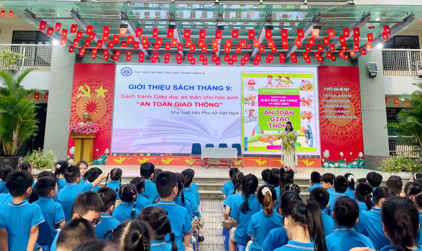 A group of people in blue shirts
Description automatically generated