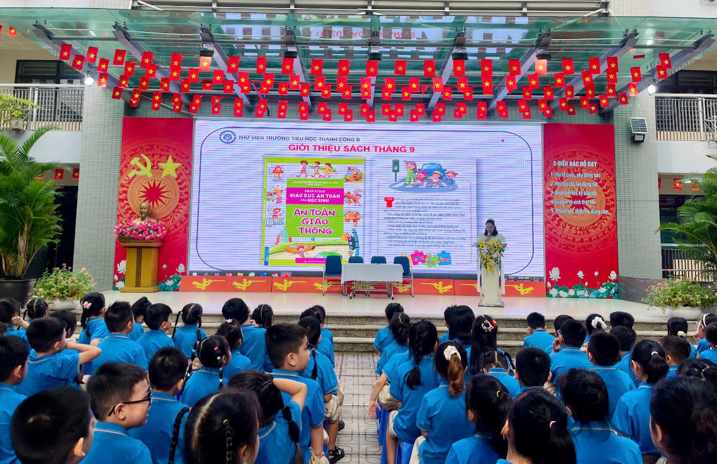 A group of children in blue shirts
Description automatically generated