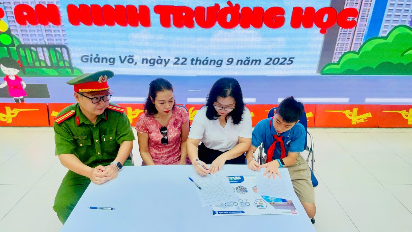 A group of people sitting at a table
Description automatically generated