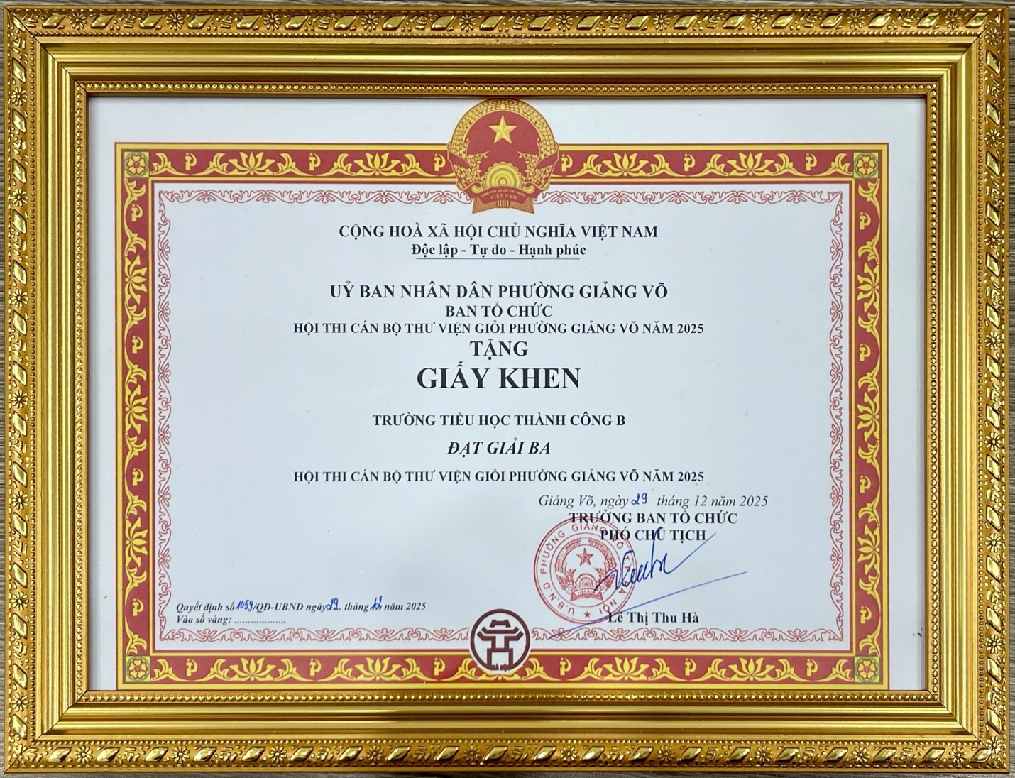 A gold framed certificate with red and black text

AI-generated content may be incorrect.