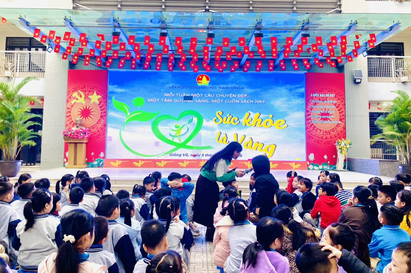 May be an image of one or more people, crowd and text